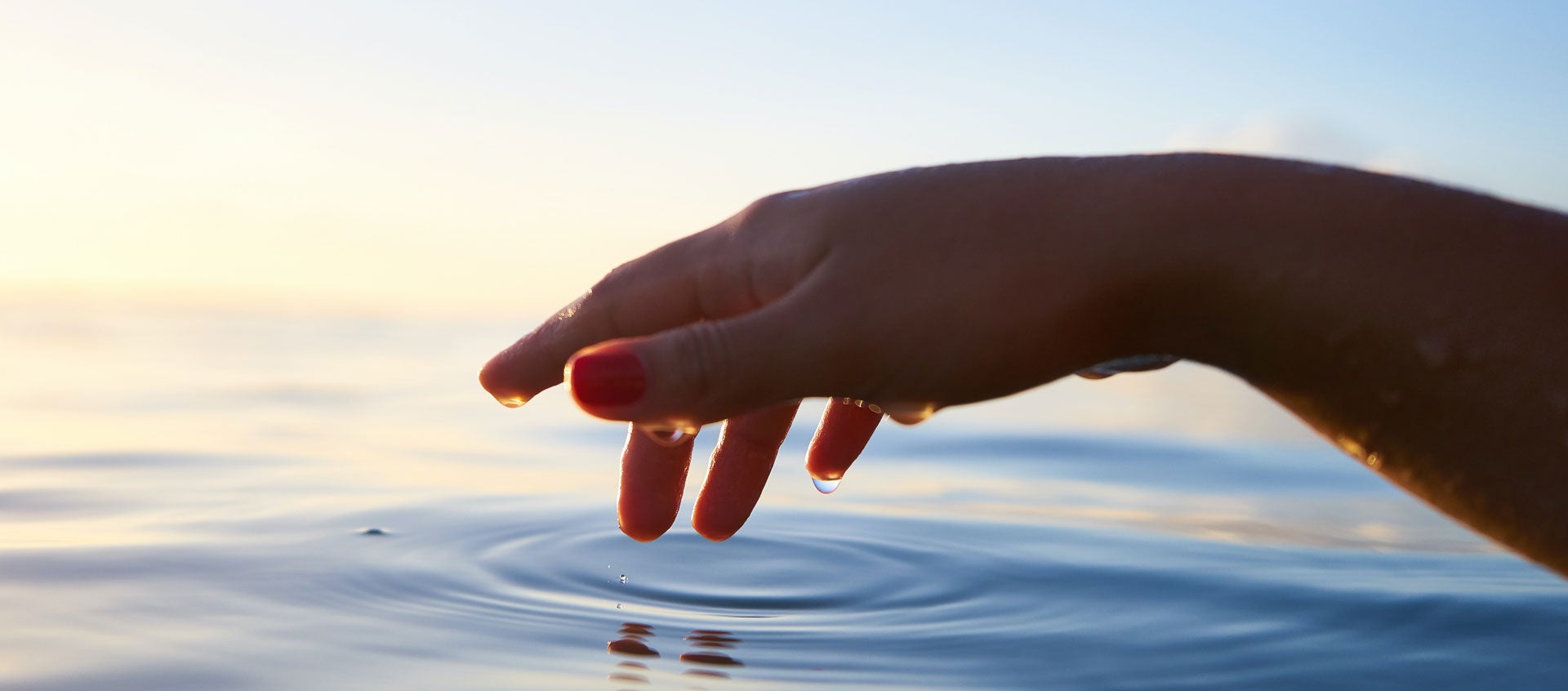hand touching water