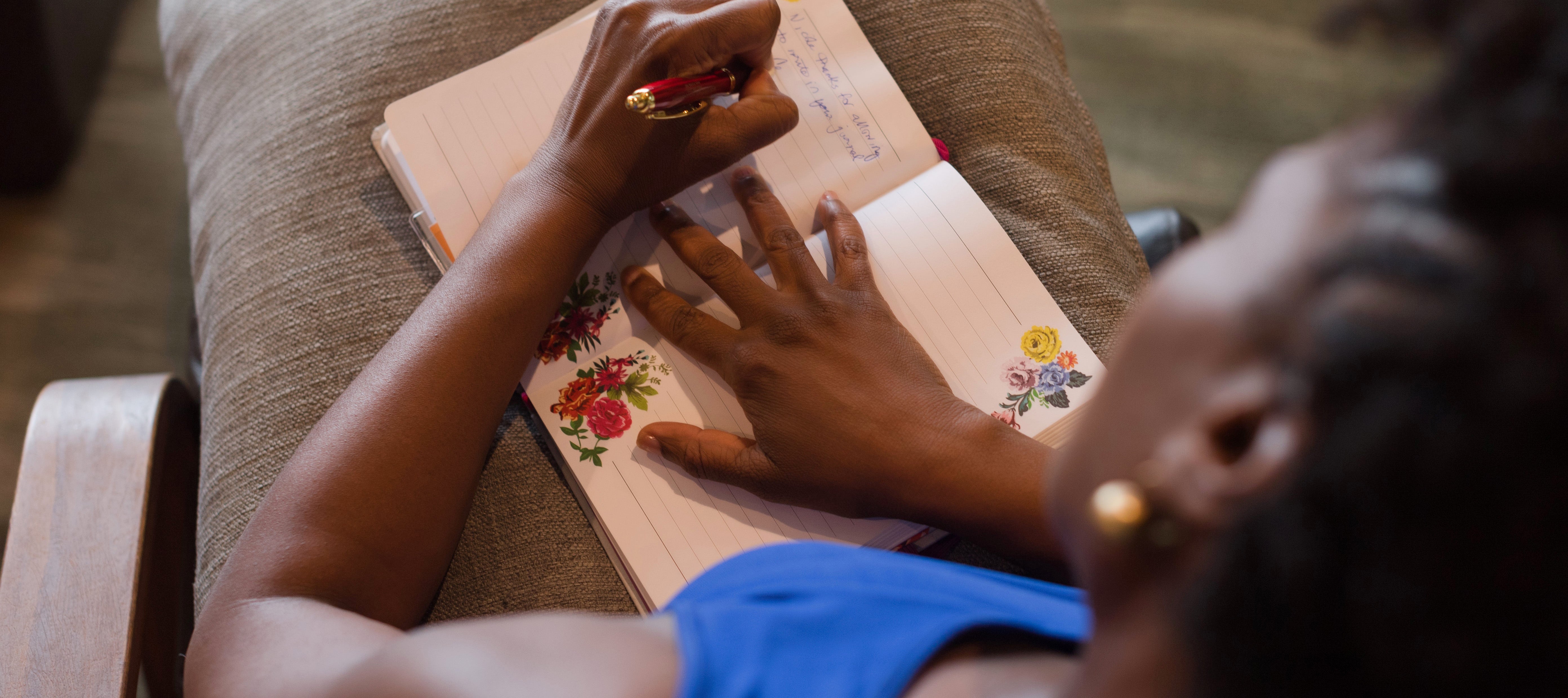Black woman writing in a journal