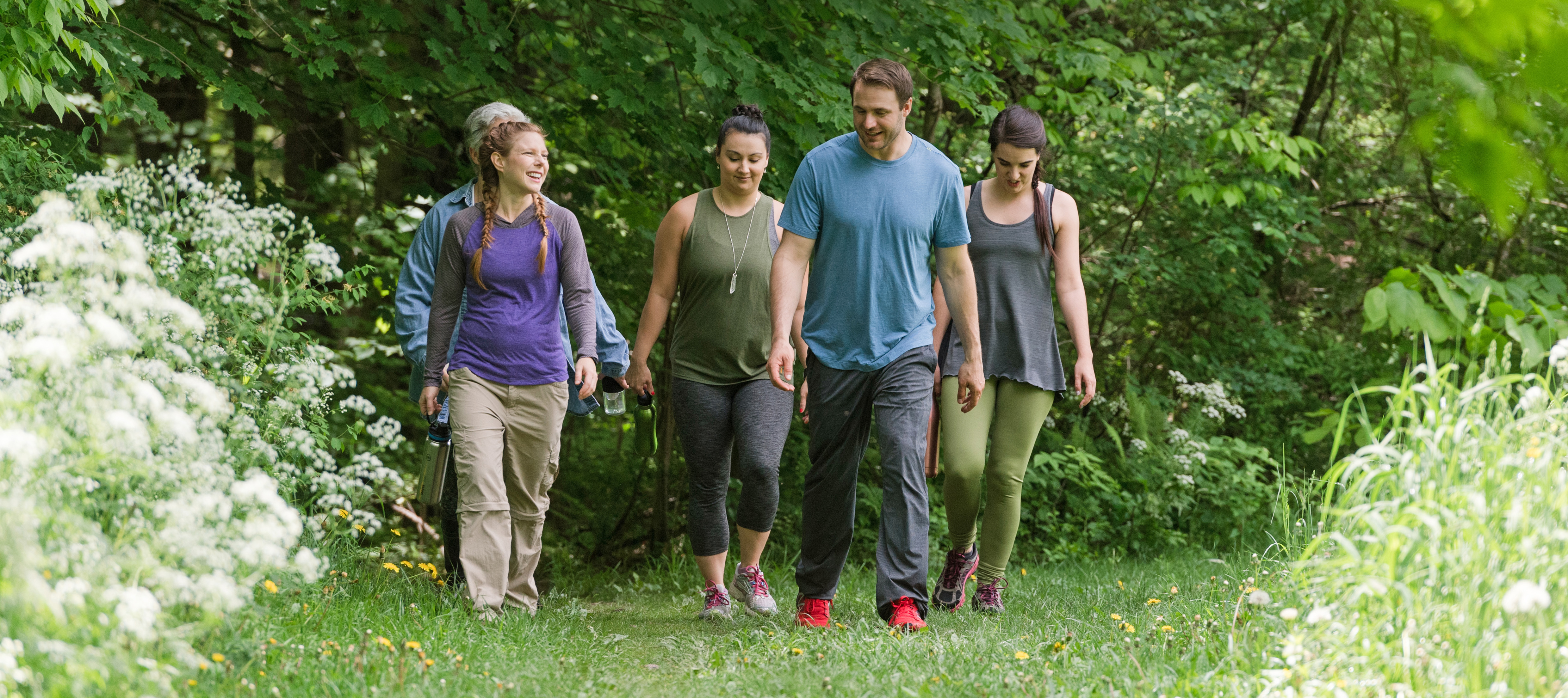 Group of people hiking outdoors in the spring