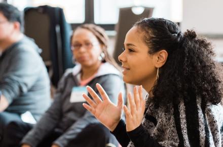 Group of people attending a yoga workshop