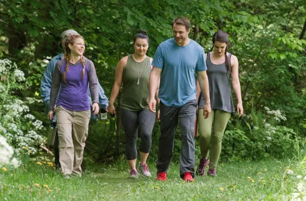 Group of people hiking outdoors in the spring