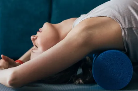 woman stretching on foam roller