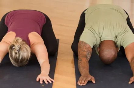 two people in child's pose