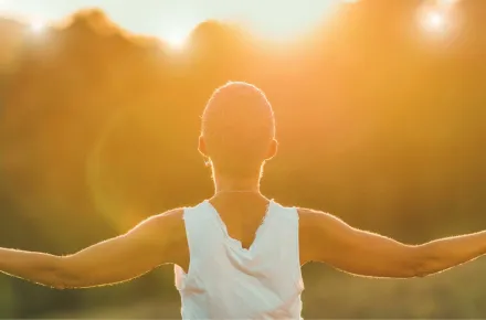 woman with arms outstretched