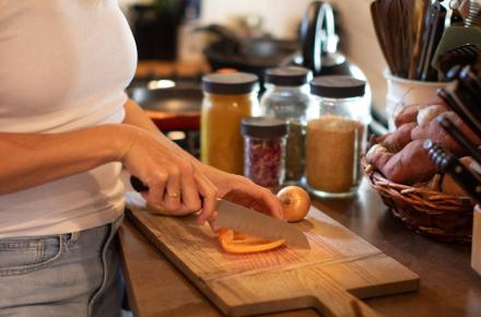 woman chopping pepper