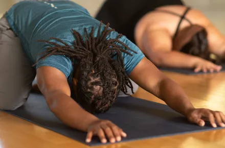 students in child's pose
