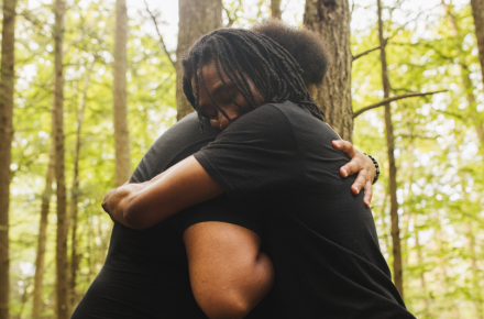 hugging in the forest