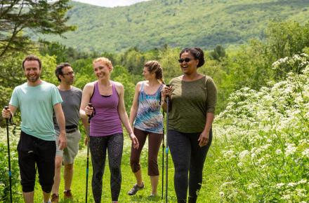 Group of people hiking in the spring at Kripalu