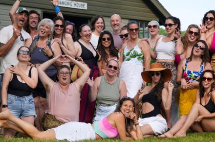 Group of people attending Love Camp, outside next to Lake Mahkeenac 