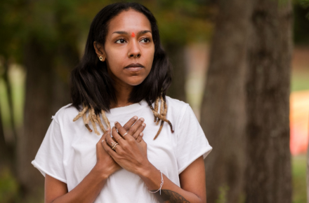 a person with the hands on the heart