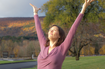yoga in the fall with arms outstretched