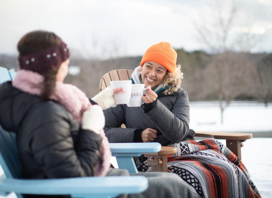 members outside drinking tea