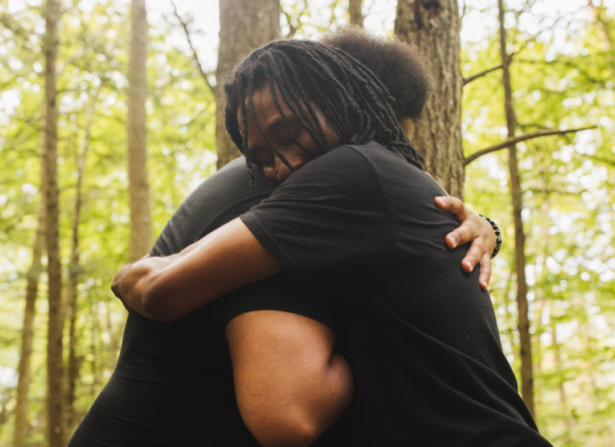 hugging in the forest