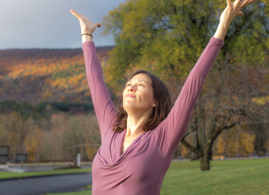 yoga in the fall with arms outstretched