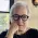 woman with white hair and glasses