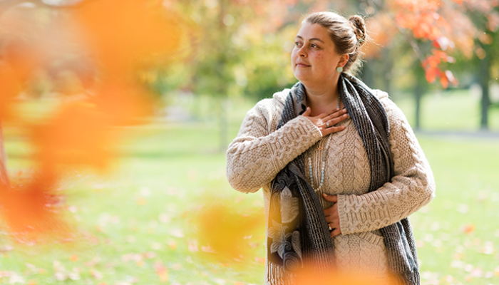 Hands to Heart Pose, Woman in Fall outside