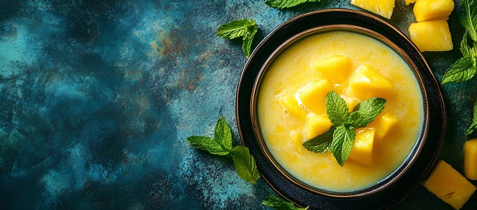 Chilled mango soup Bowl of chilled mango soup garnished with mint