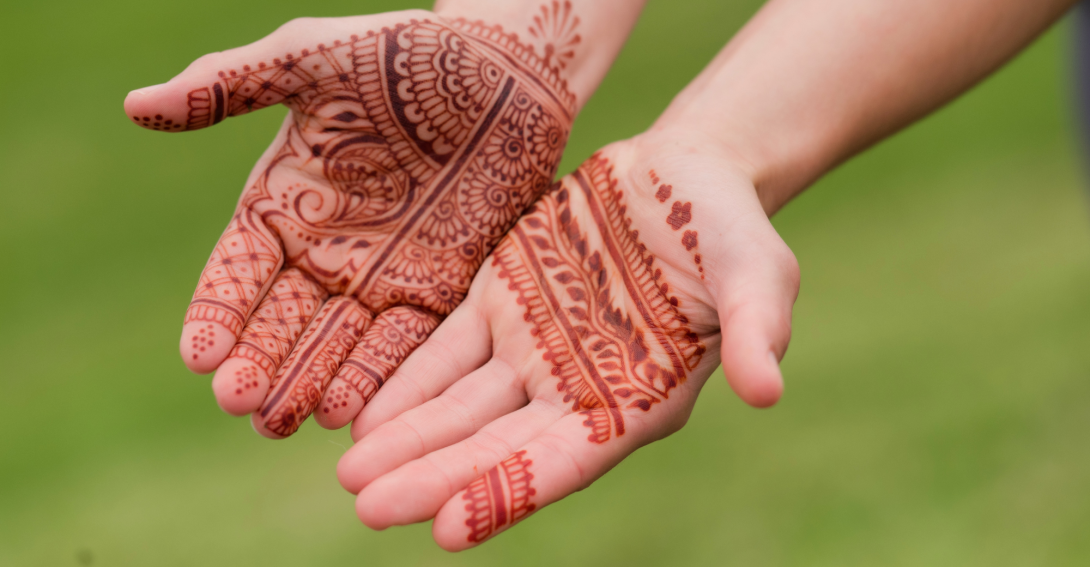 hands with henna on them