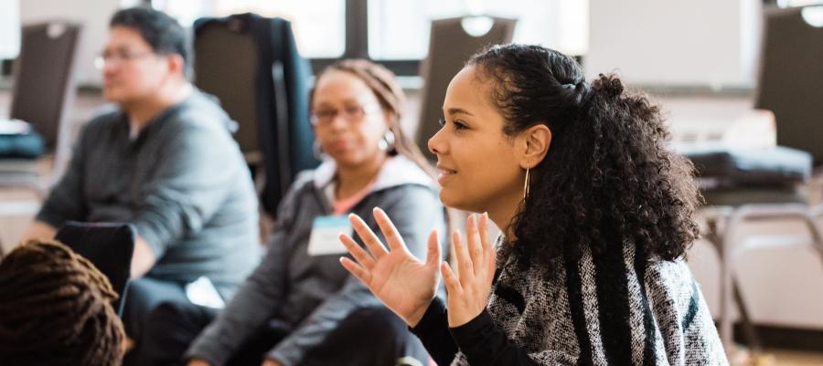 Group of people attending a yoga workshop