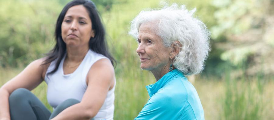 two women sitting outside