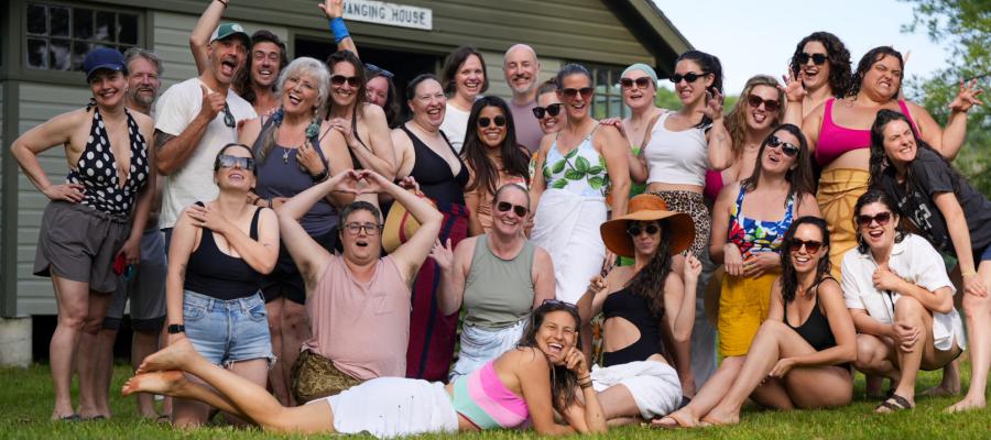 Group of people attending Love Camp, outside next to Lake Mahkeenac 