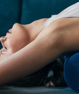 woman stretching on foam roller