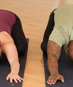 two people in child's pose