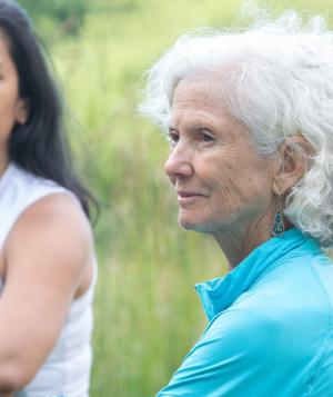 two women sitting outside