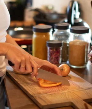 woman chopping pepper