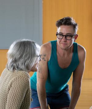 Diverse group of people talking during a yoga class