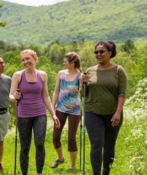 Group of people hiking in the spring at Kripalu