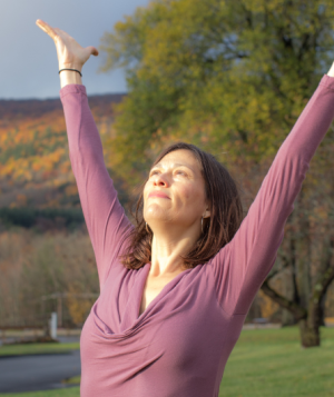 yoga in the fall with arms outstretched